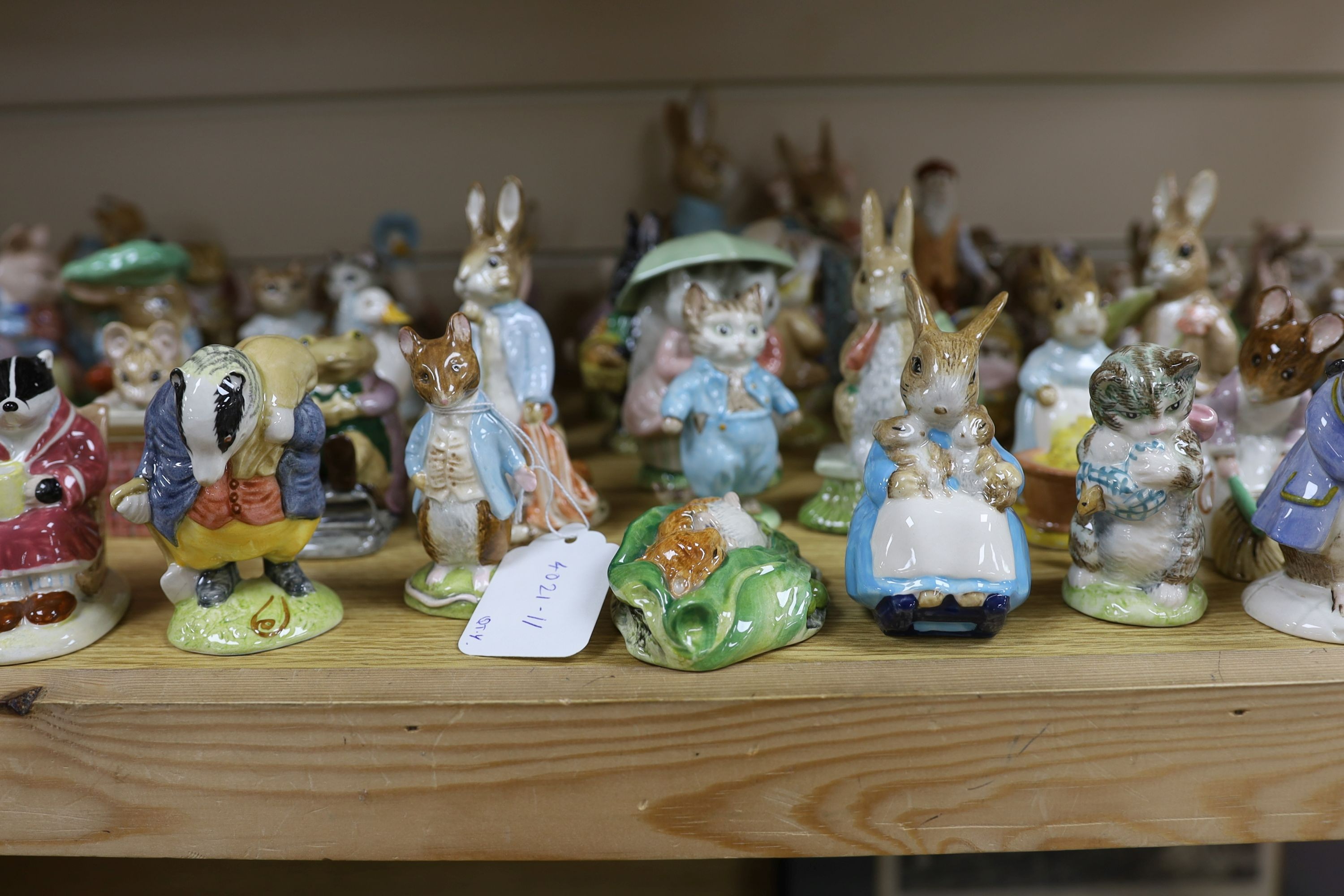 A large collection of Beatrix Potter ceramic figures by Royal Doulton, Beswick and Royal Albert, to include ‘Sir Isaac Newton’ and ‘Mr McGregor’